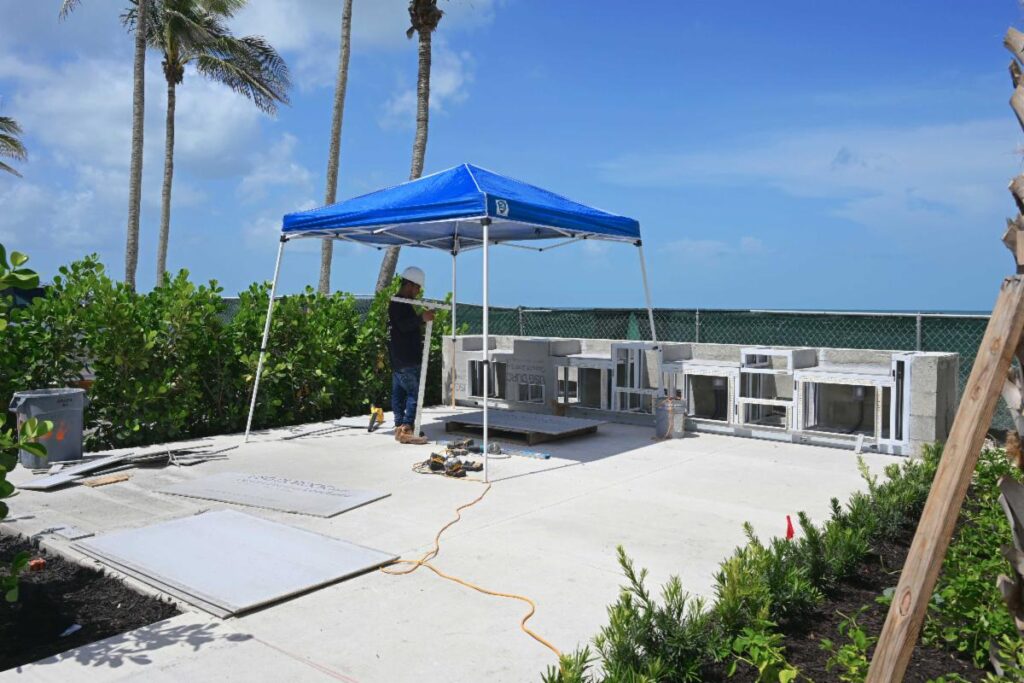 The crew is preparing the barbecue area for stucco.