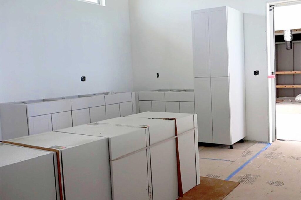 Work in the catering kitchen is advancing, including cabinet installation.