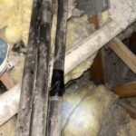 A photo of corroded refrigerant line insulation for a residential air conditioning system