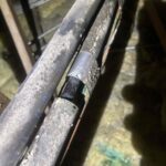 A photo of corroded refrigerant line insulation for a residential air conditioning system